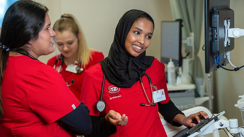 Student at bedside computer station